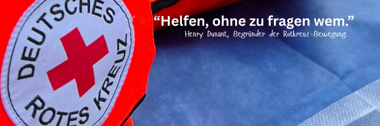 Rundes DRK Armpatch und blaue Einmaldecke.
